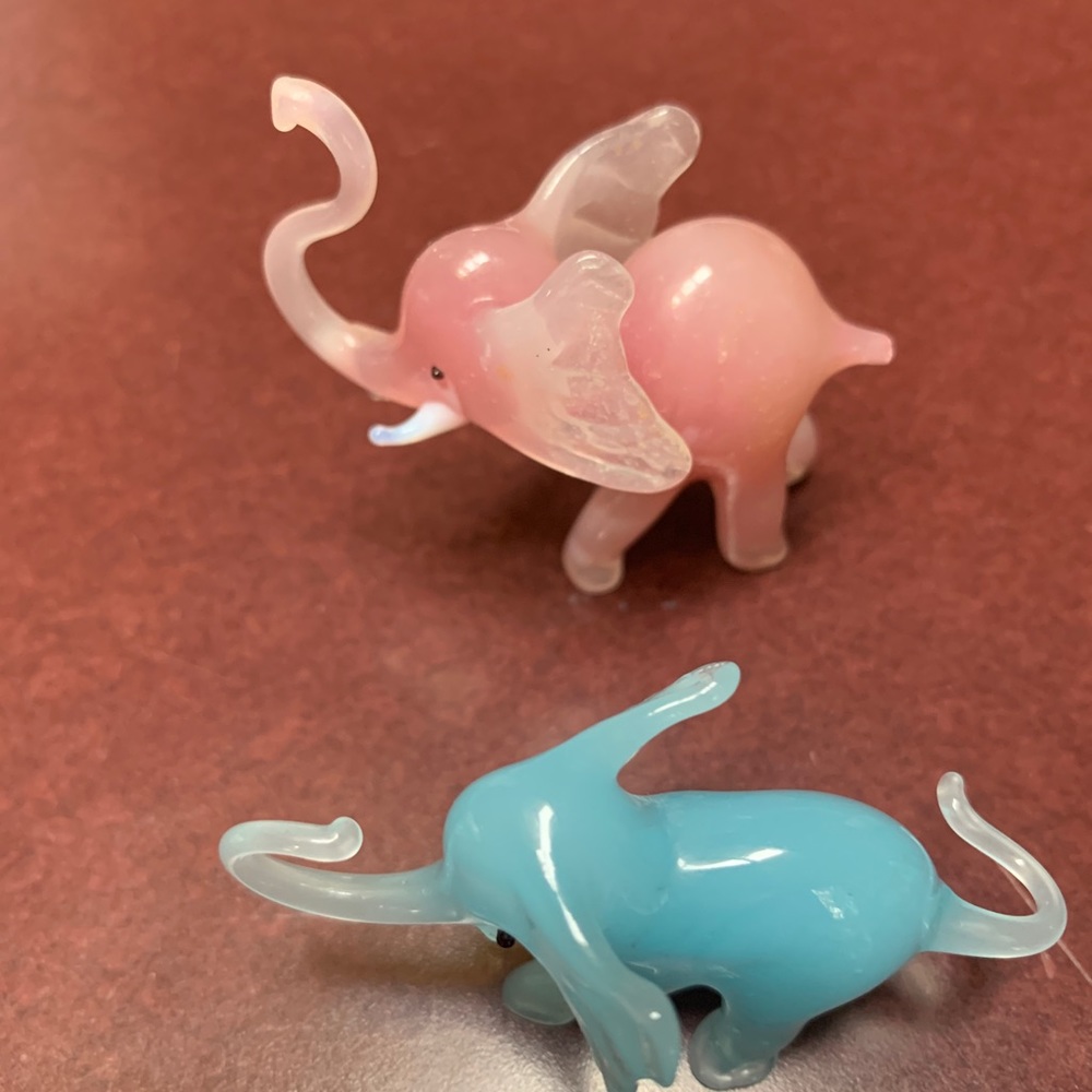 Glass elephant trinkets.